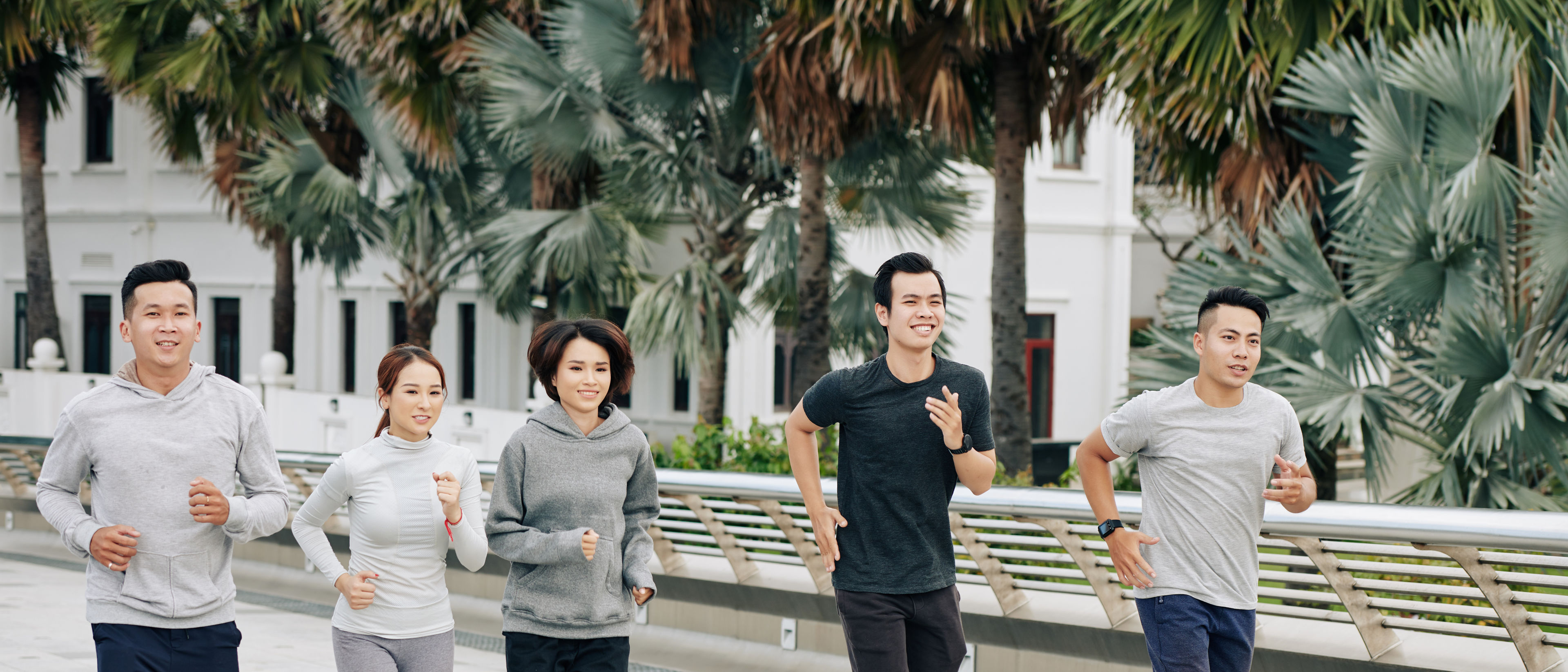 Adults are jogging together outdoors.